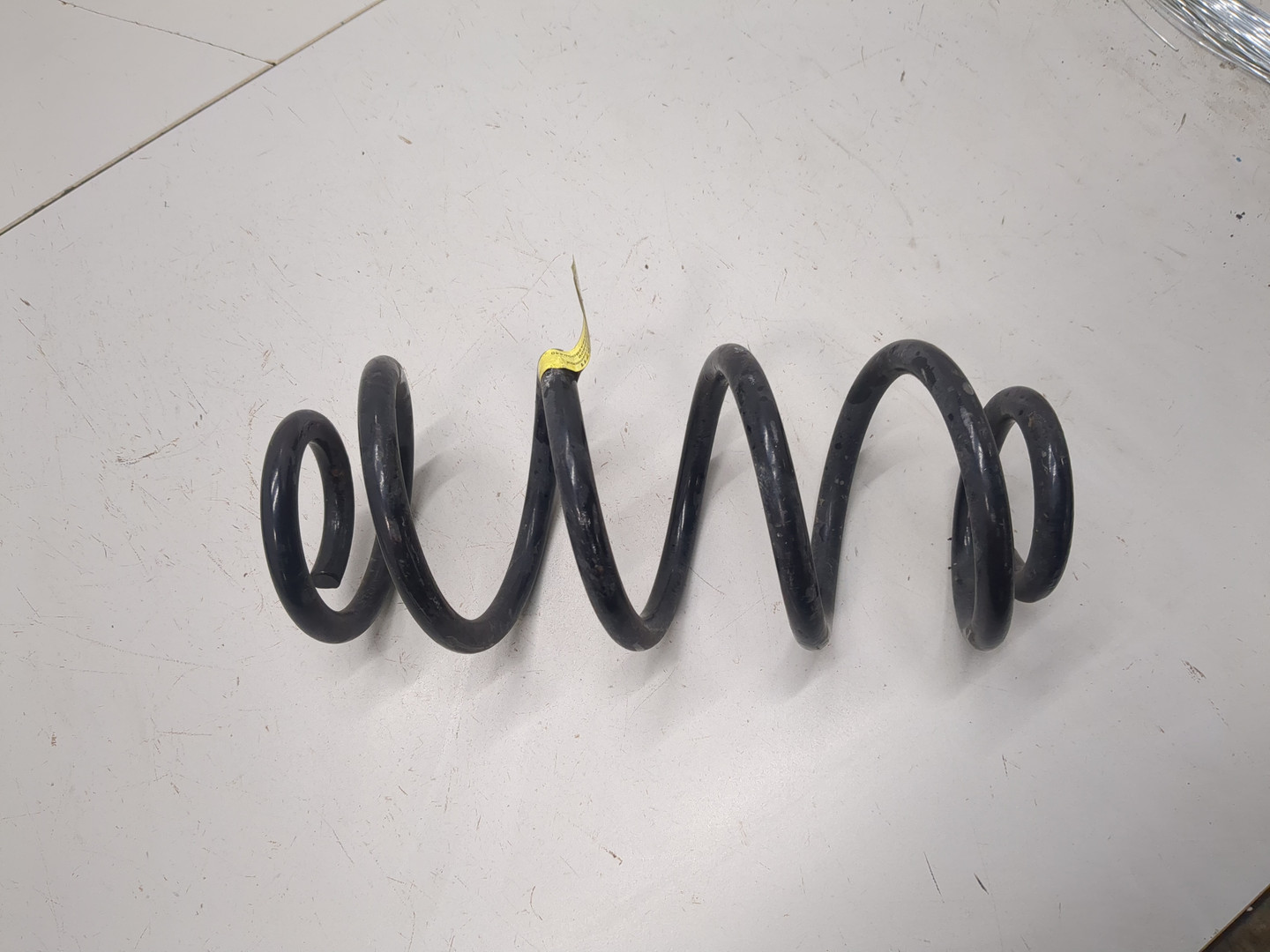 Пружина задняя