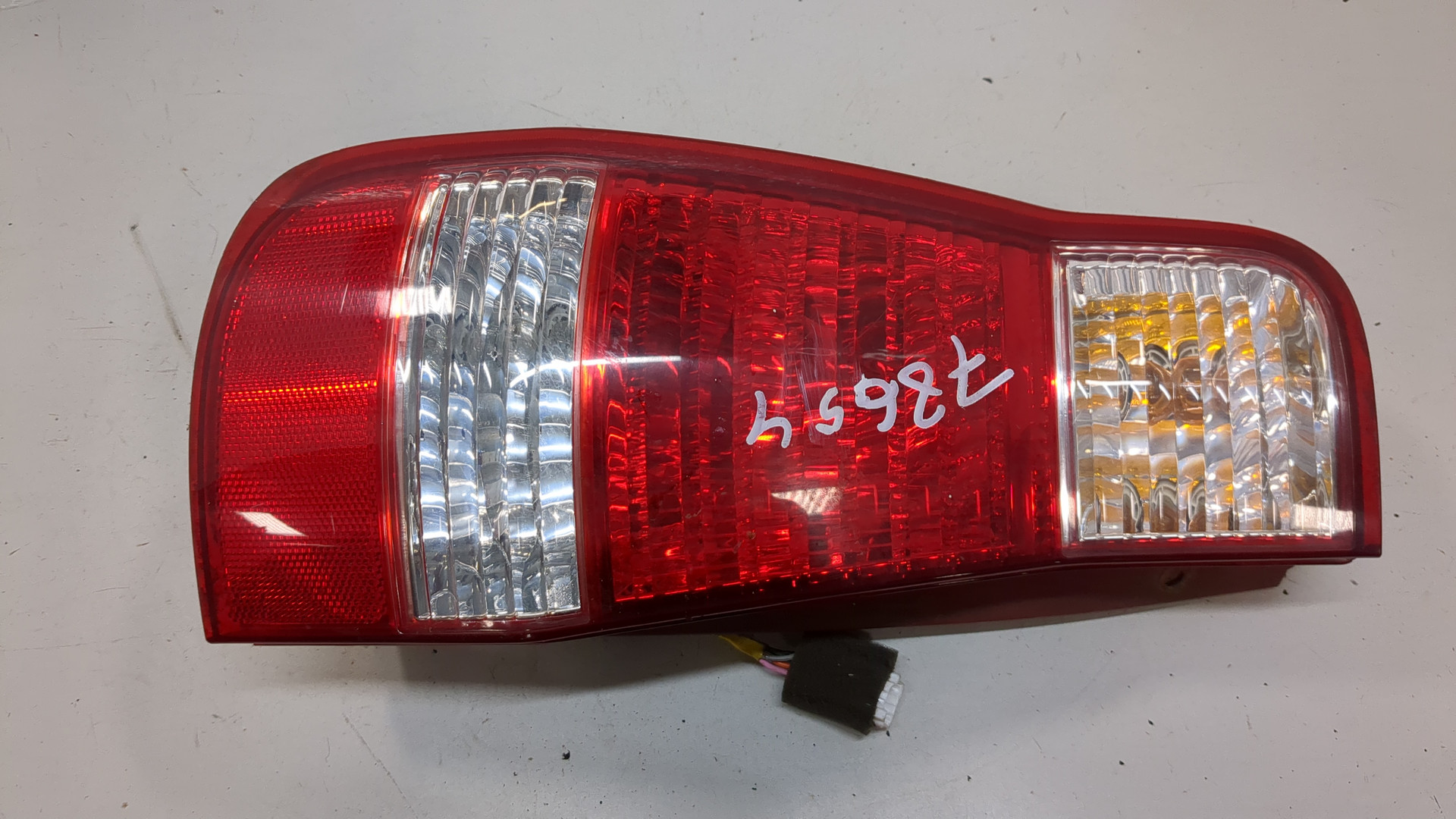 Фонарь задний левый