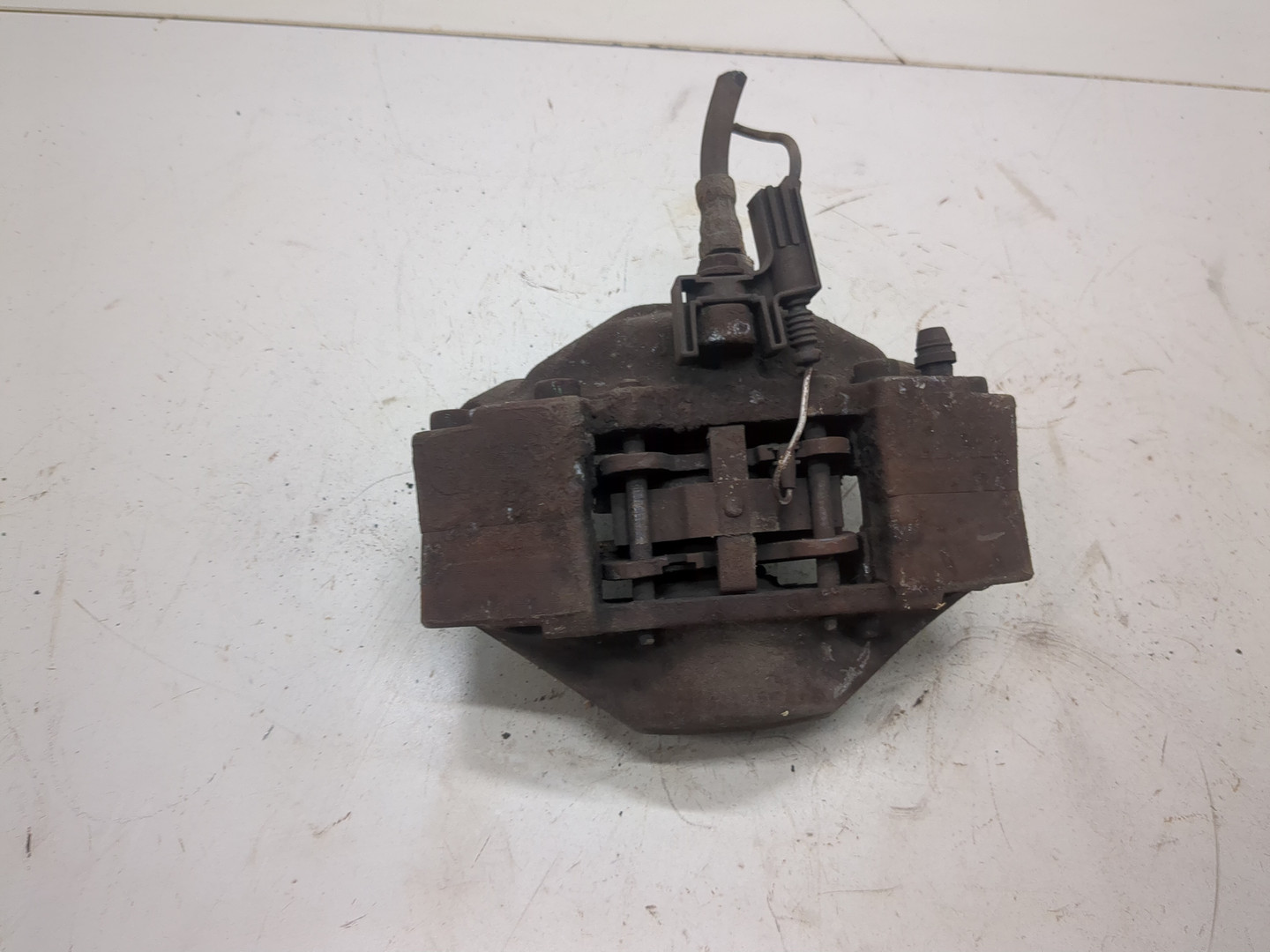 Суппорт задний левый