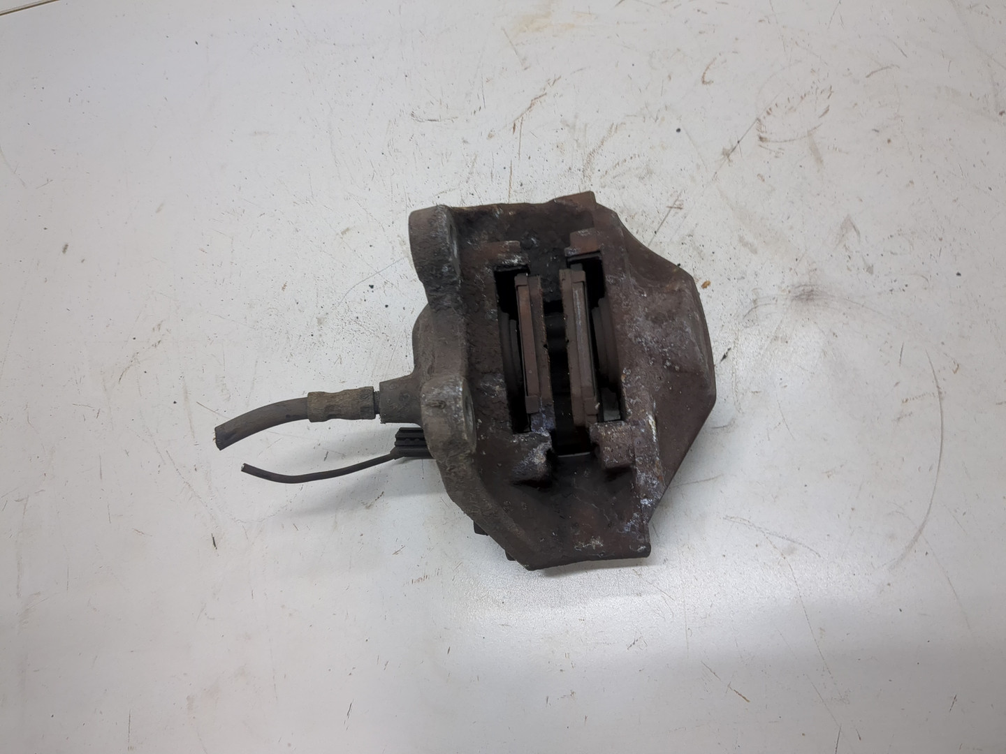 Суппорт задний левый