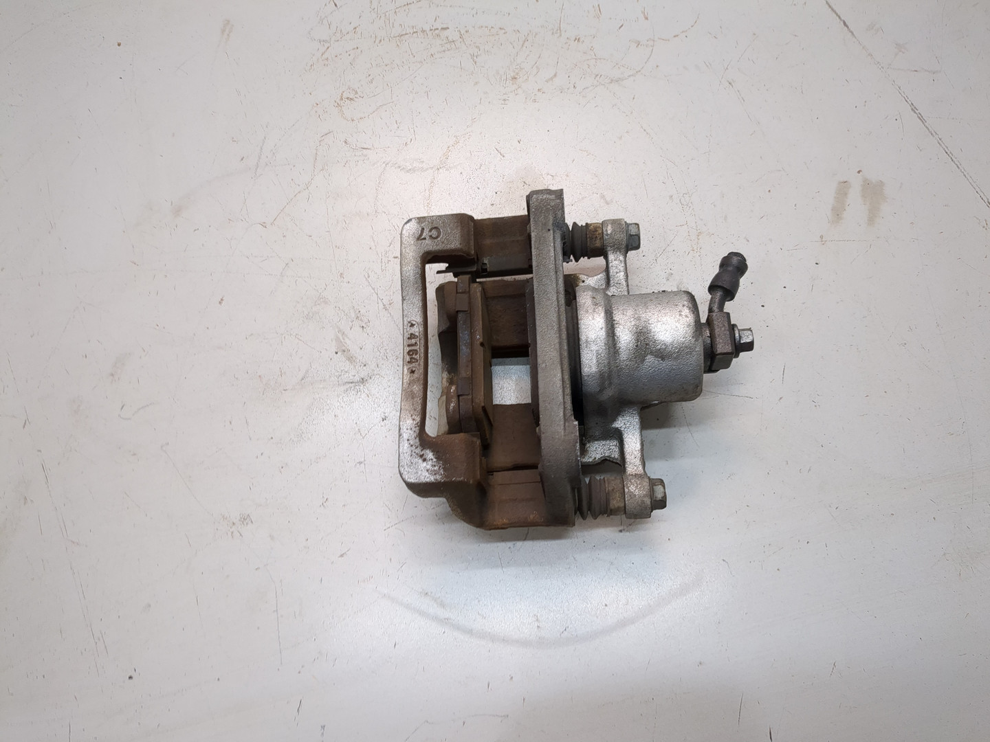 Суппорт задний левый