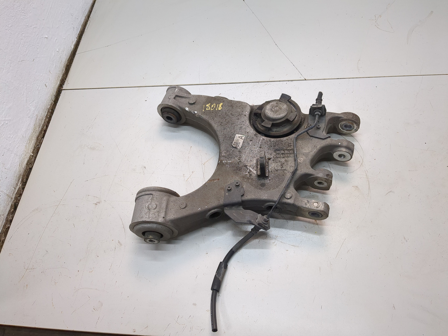 Рычаг задний левый