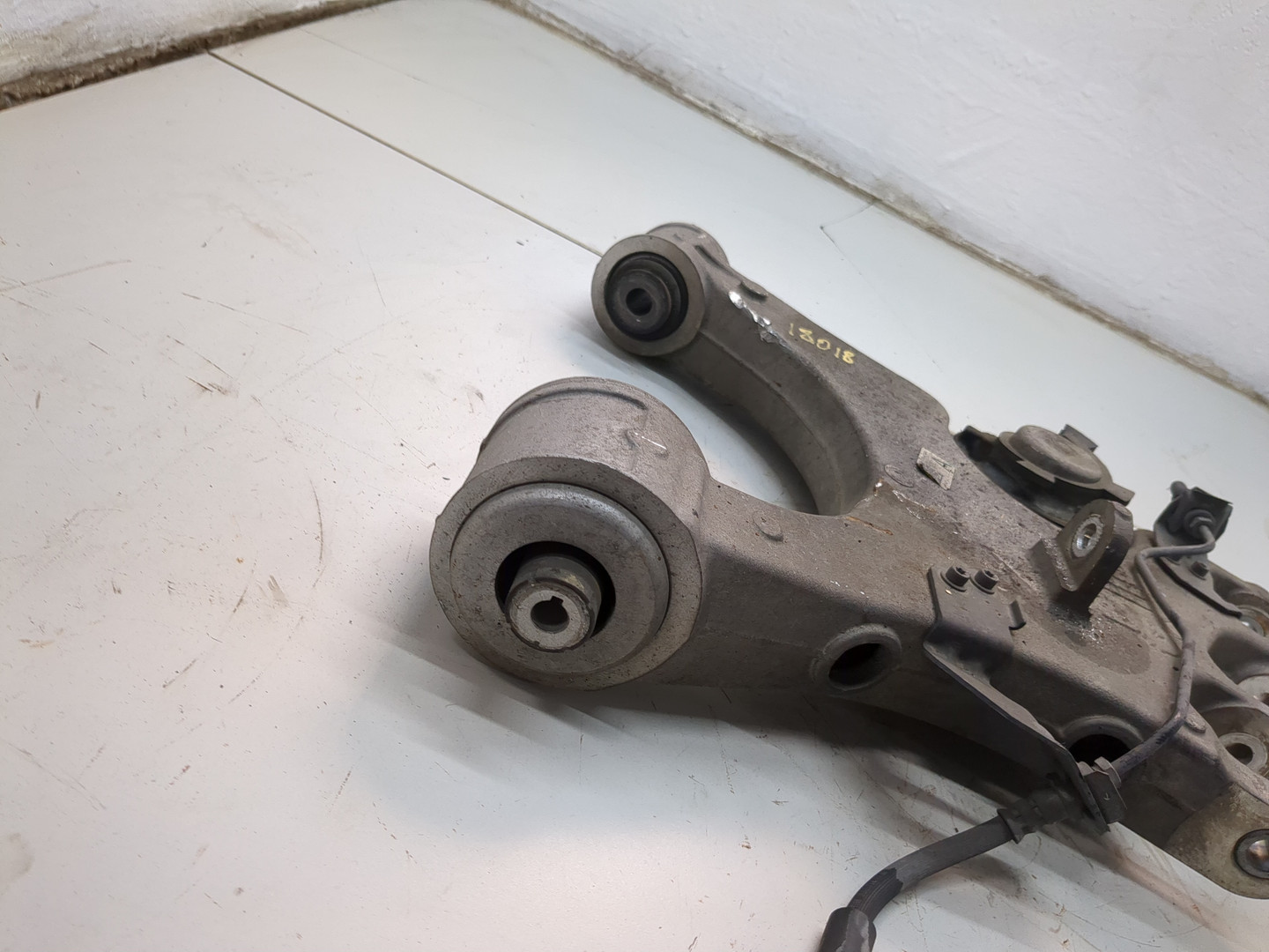 Рычаг задний левый