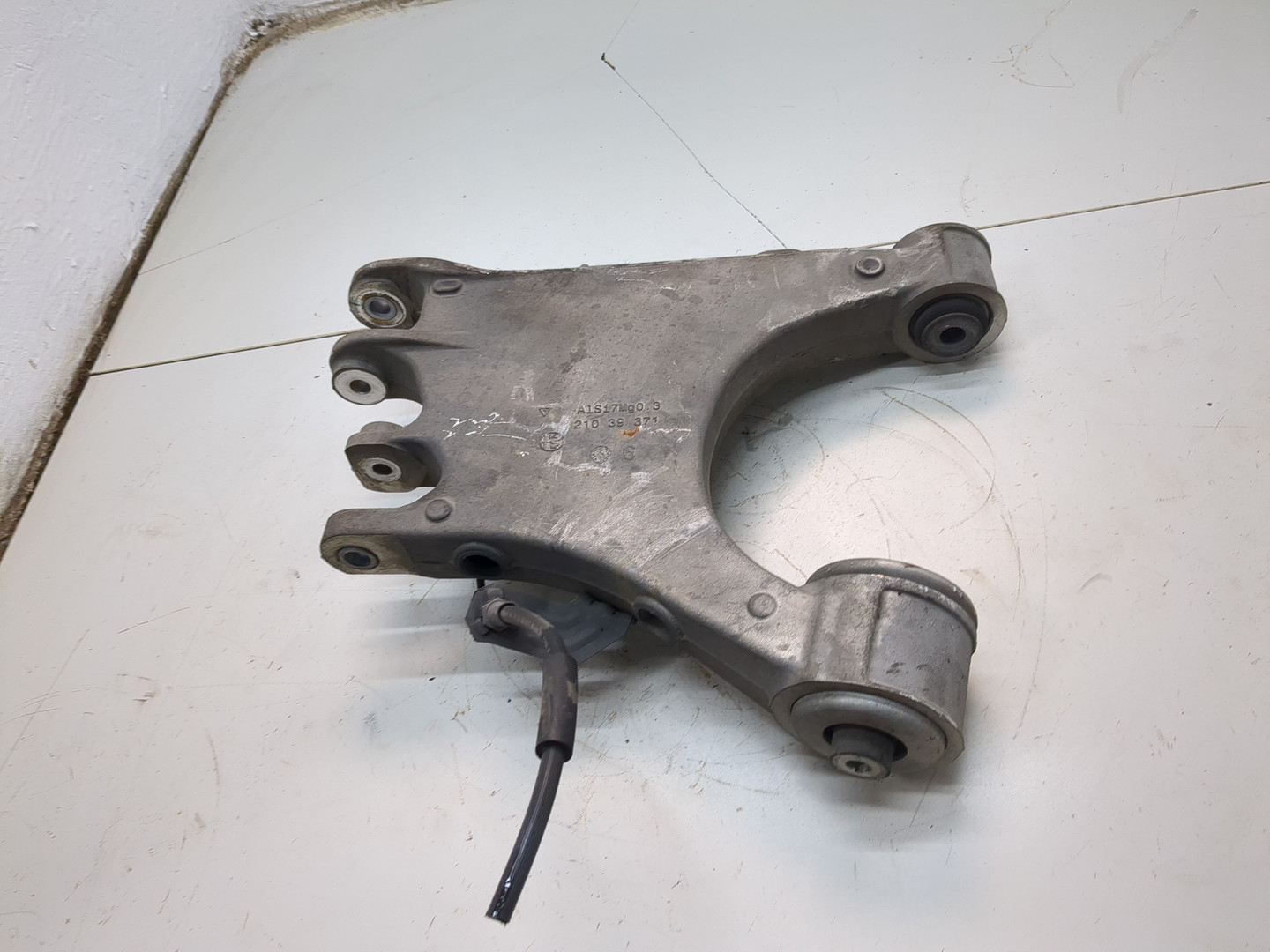 Рычаг задний левый