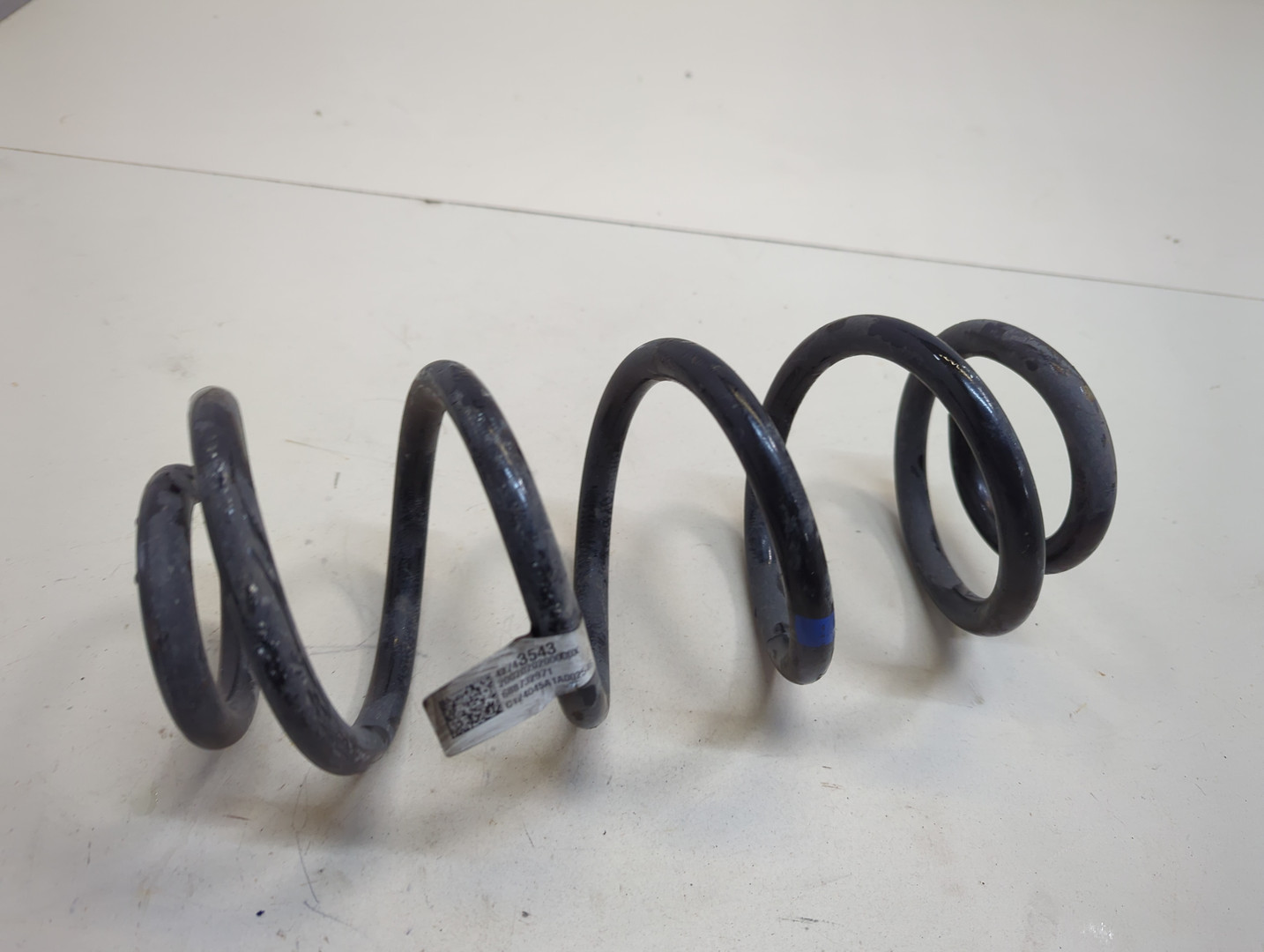 Пружина задняя