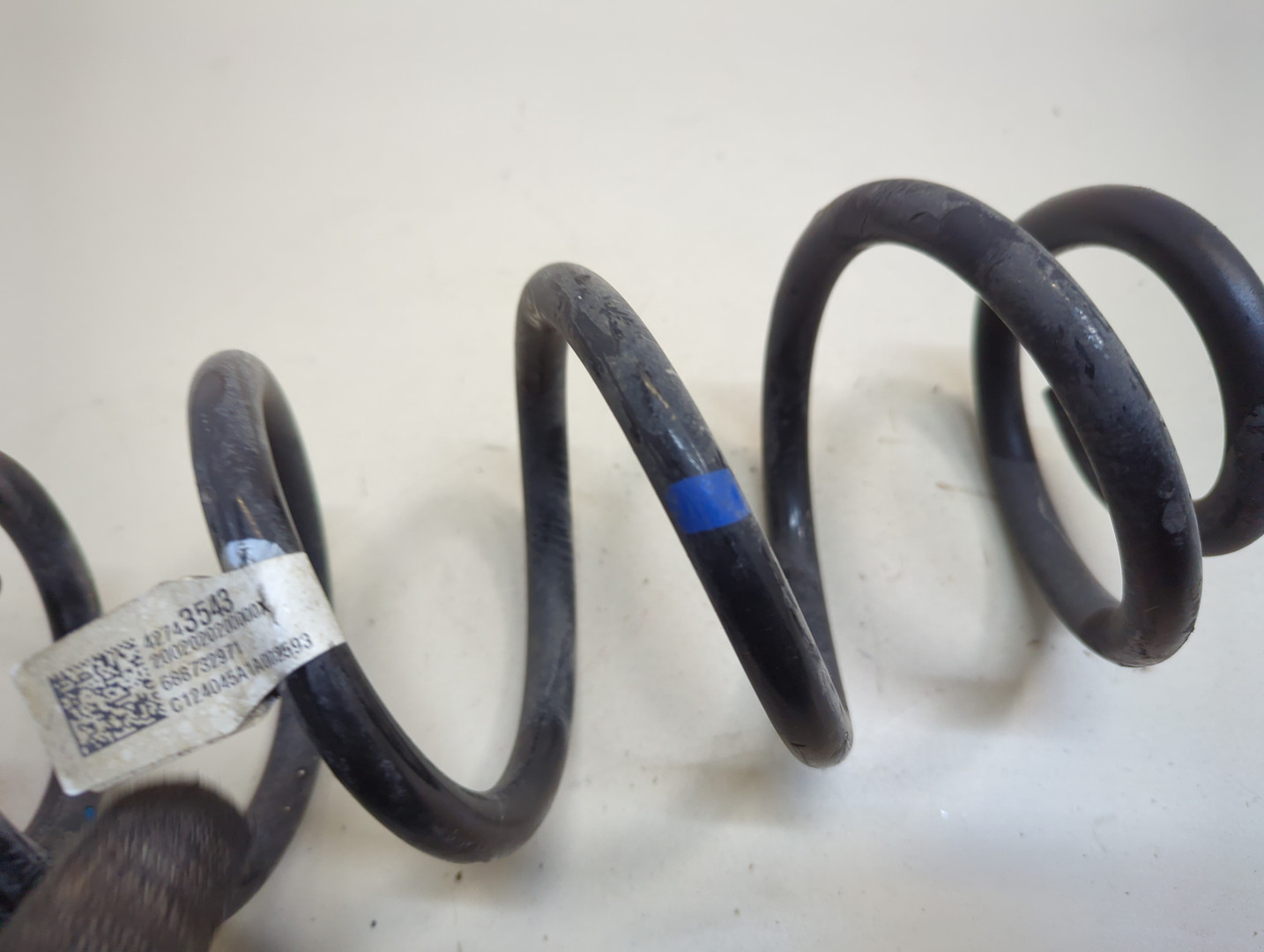 Пружина задняя