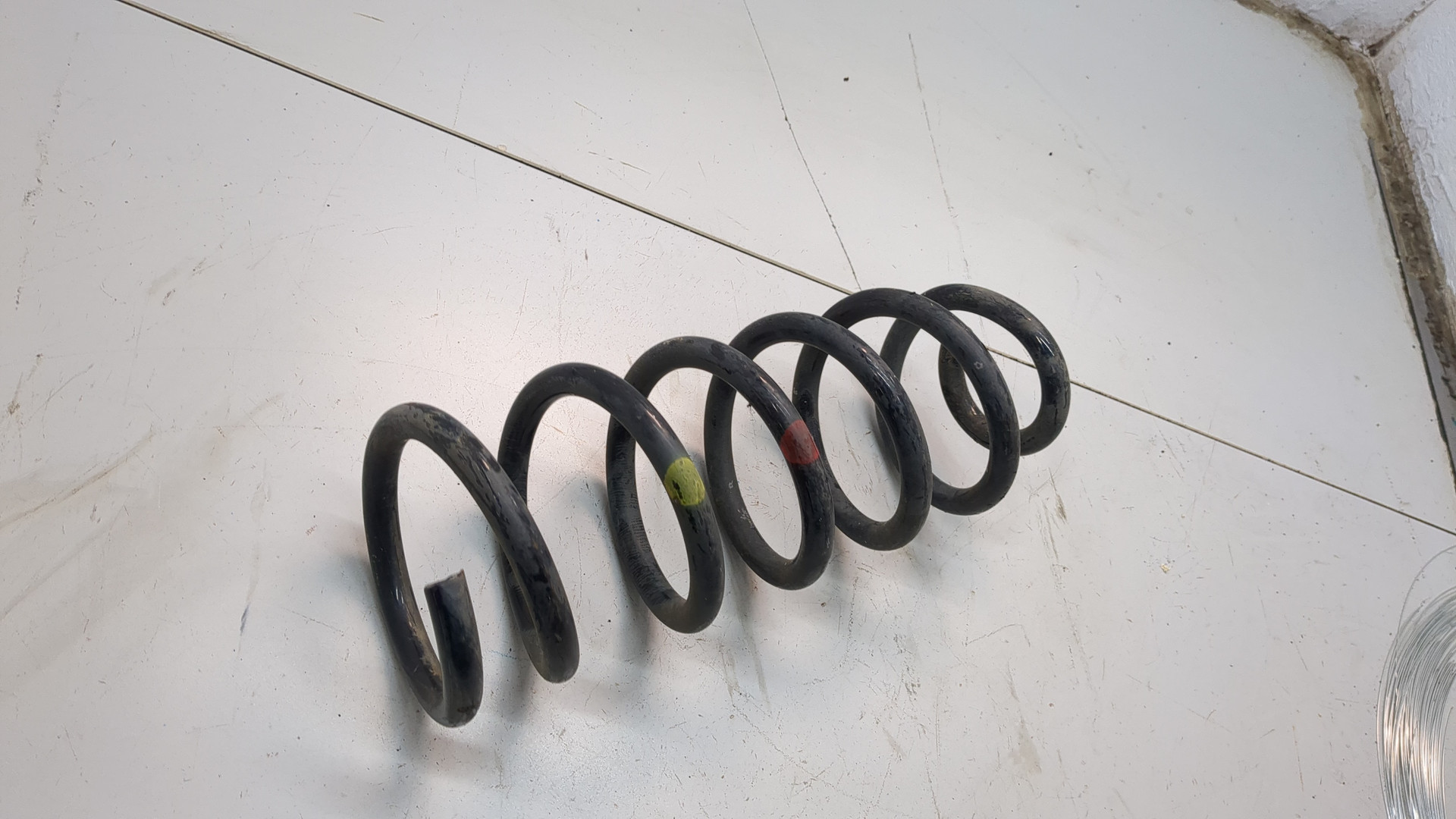 Пружина задняя