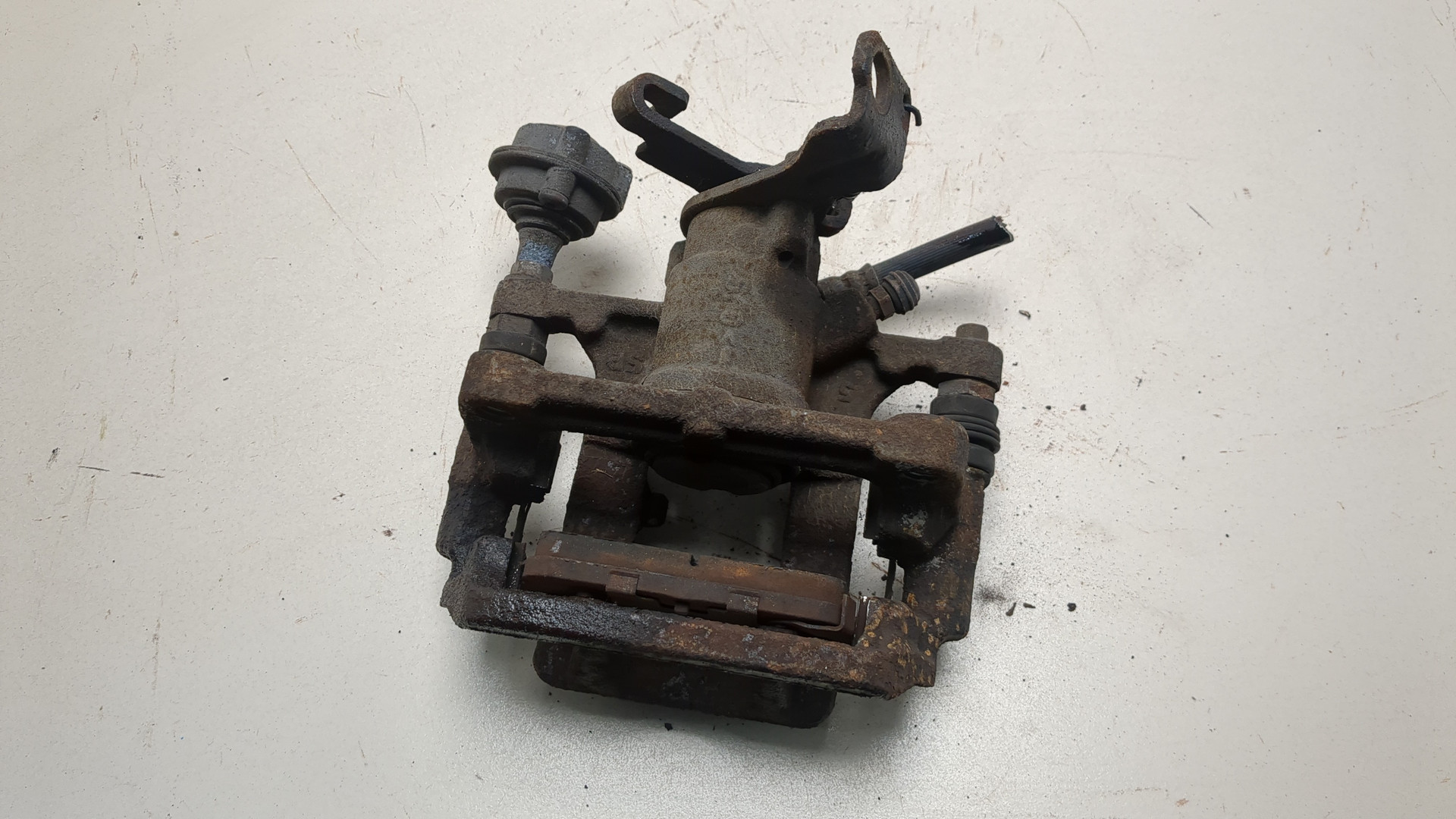 Суппорт задний левый