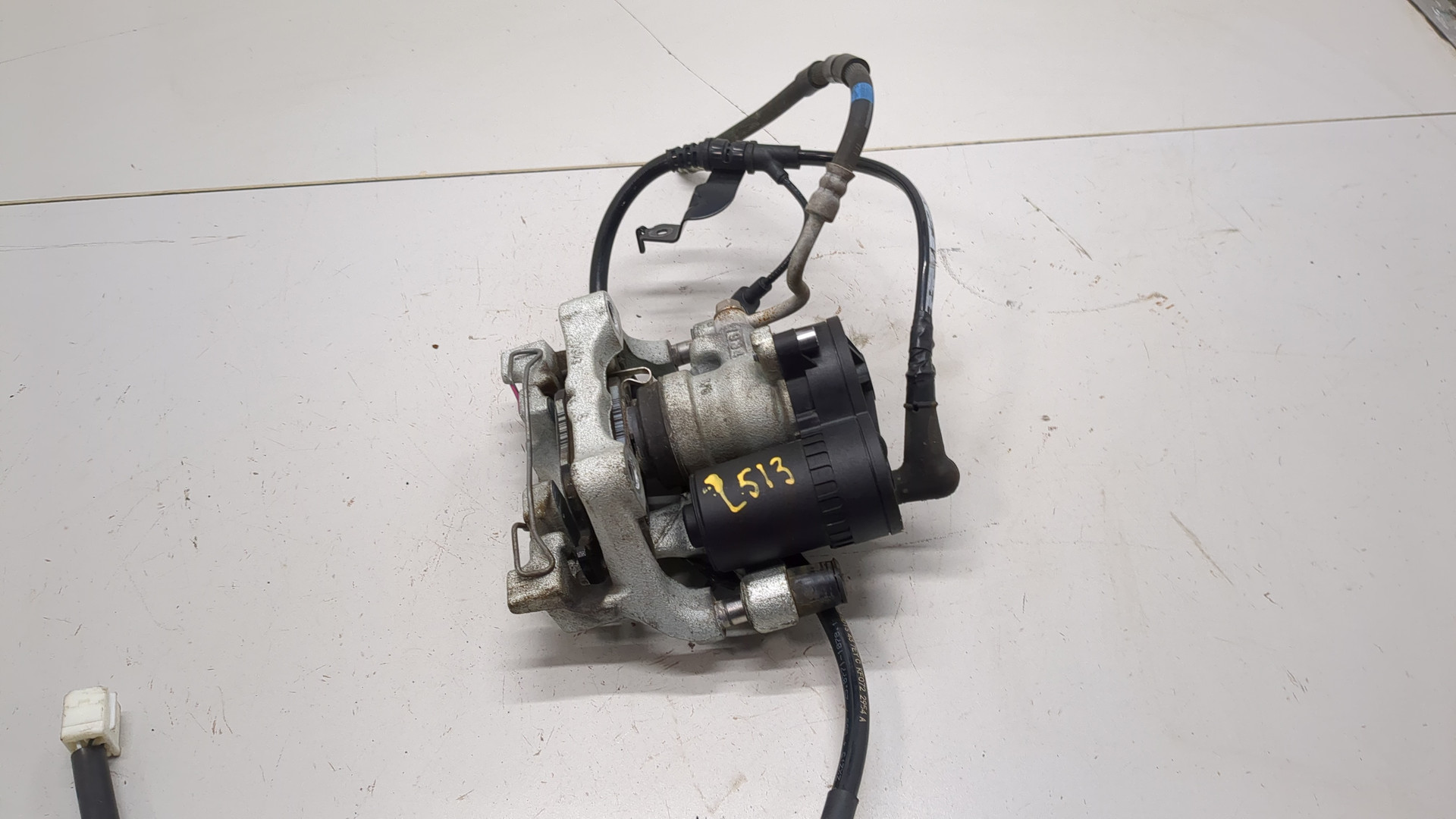 Суппорт задний левый