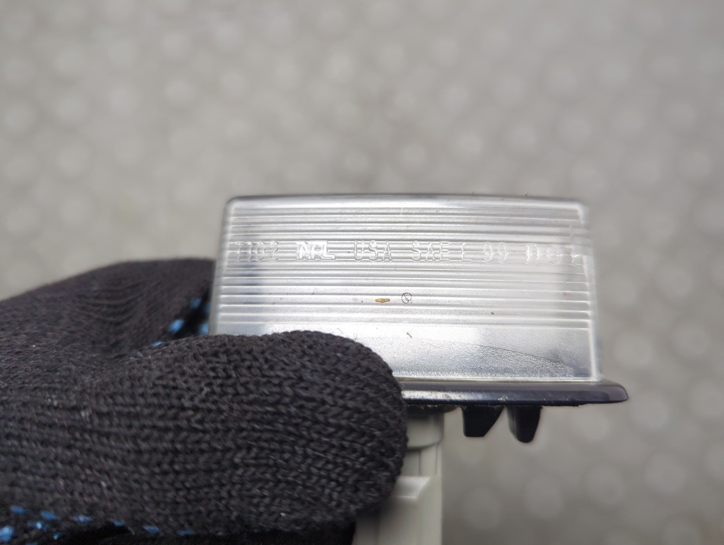 Фонарь подсветки номера