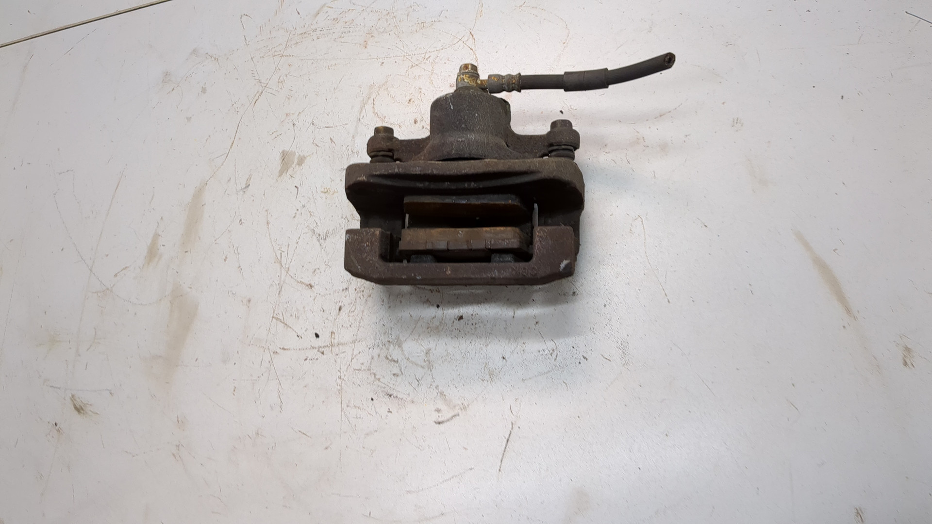 Суппорт задний левый