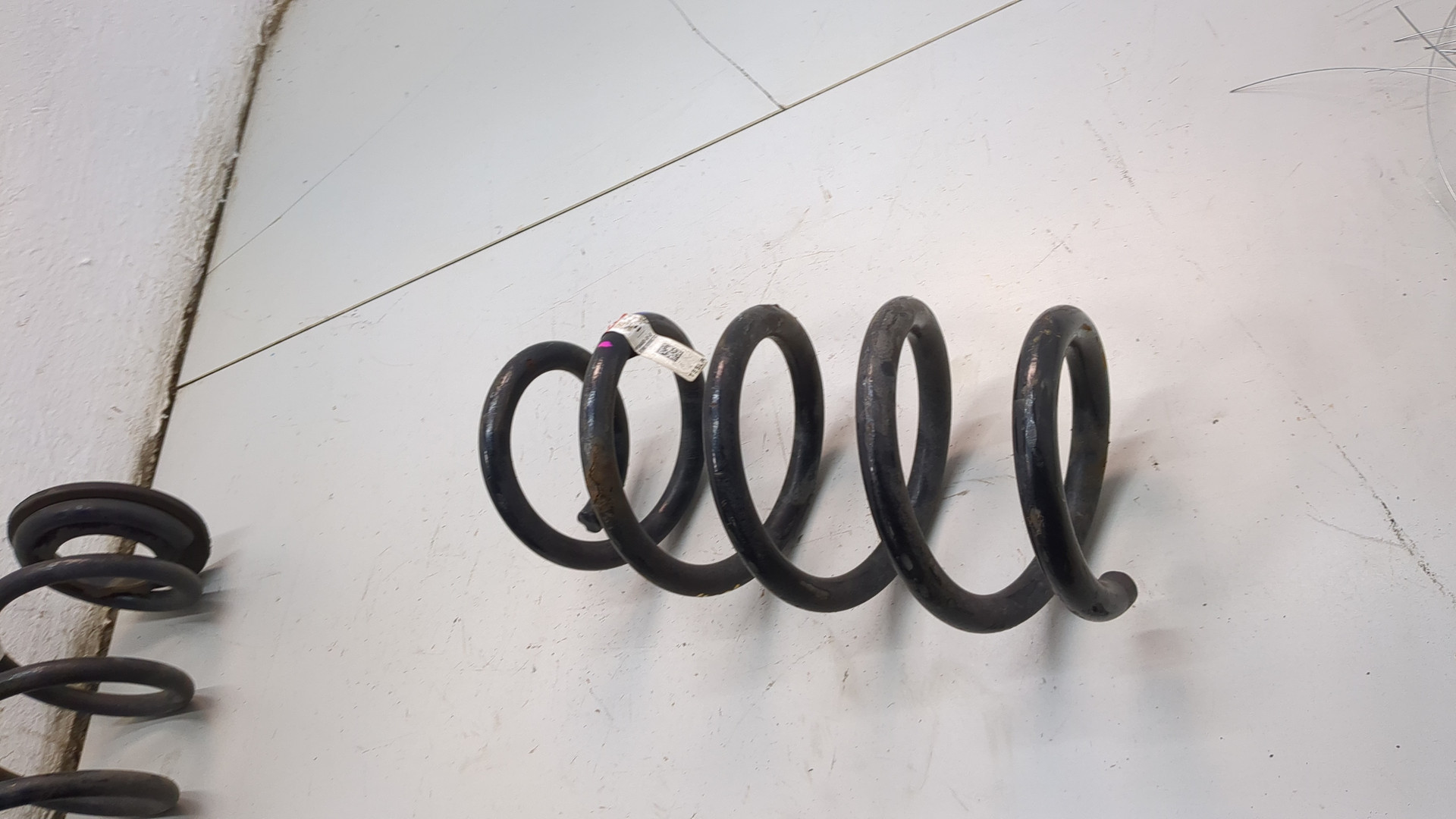 Пружина задняя