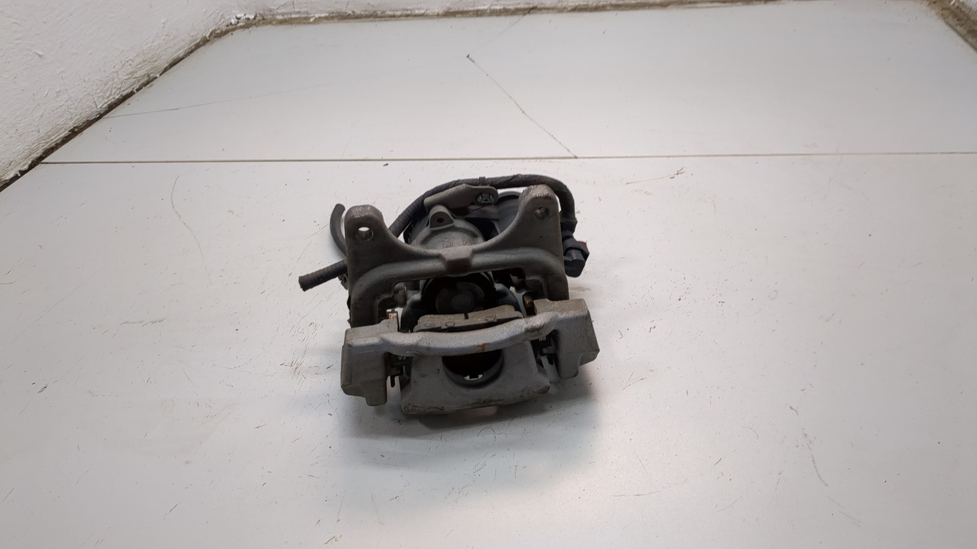 Суппорт задний левый