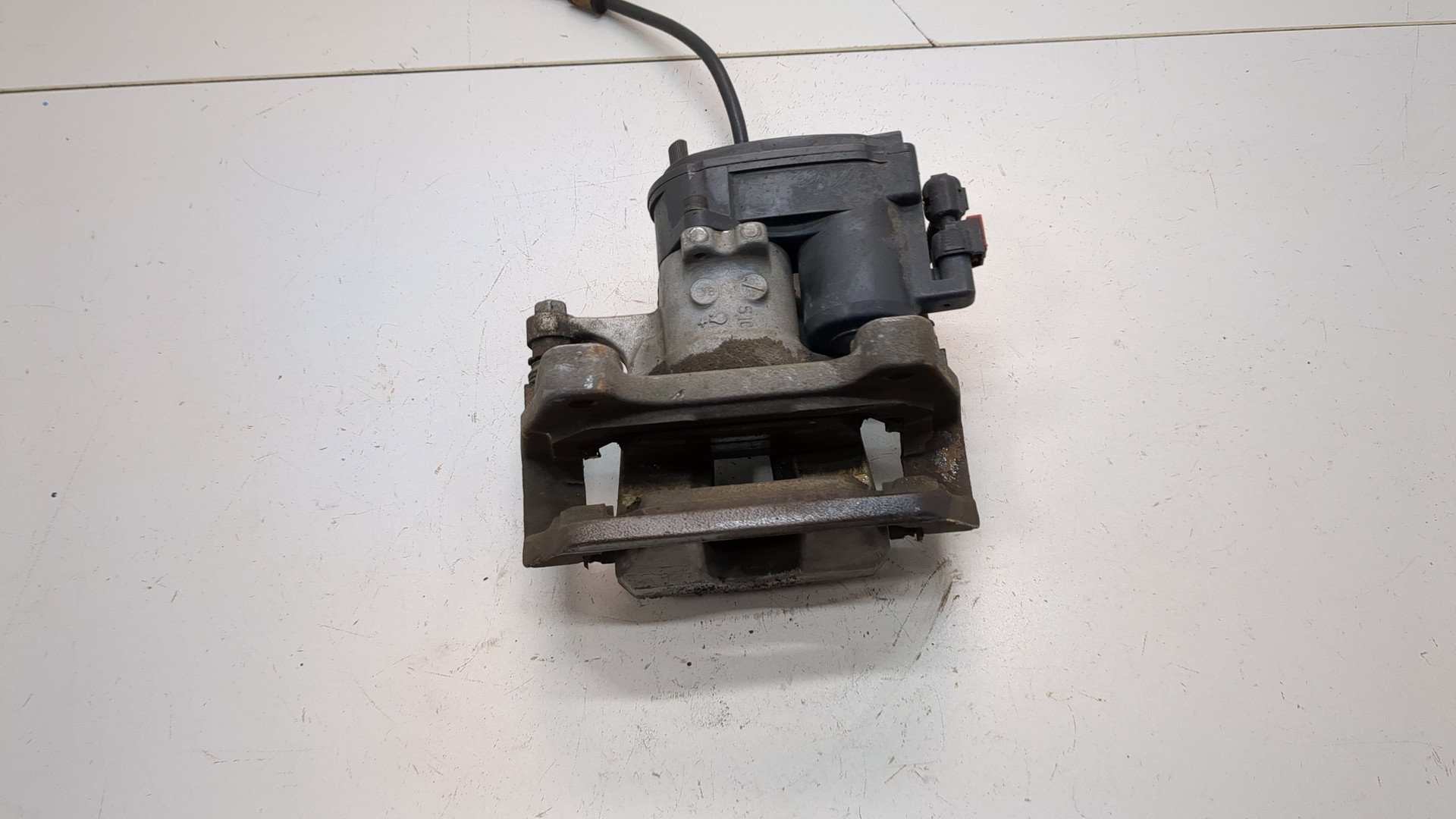 Суппорт задний левый