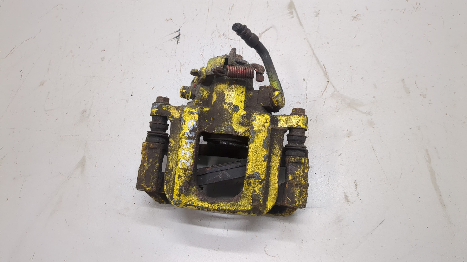 Суппорт задний левый