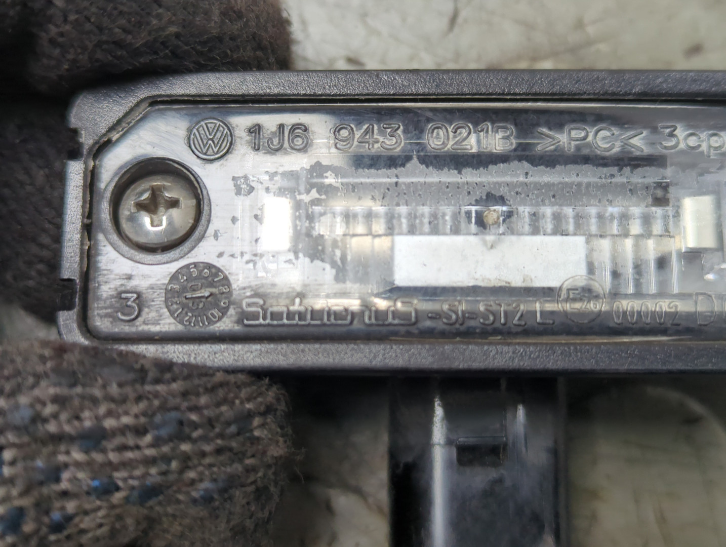 Фонарь подсветки номера