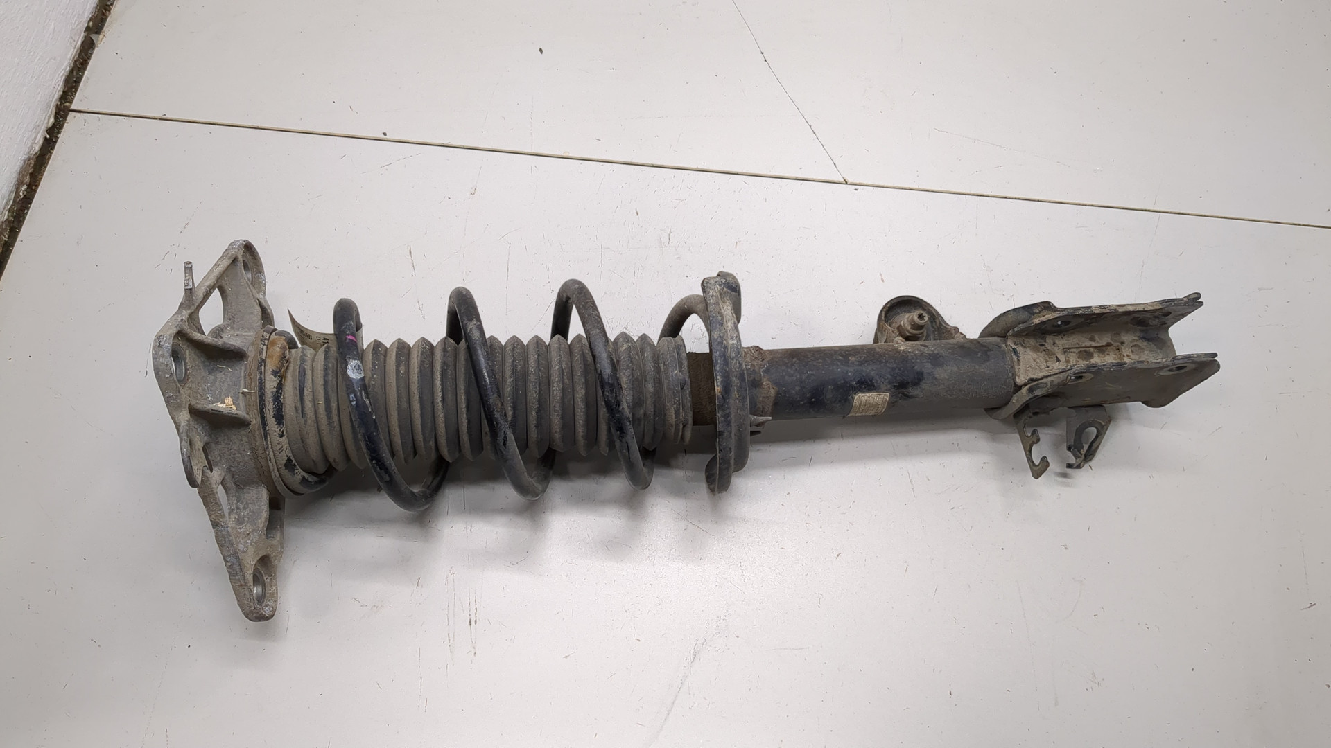 Амортизатор задний левый