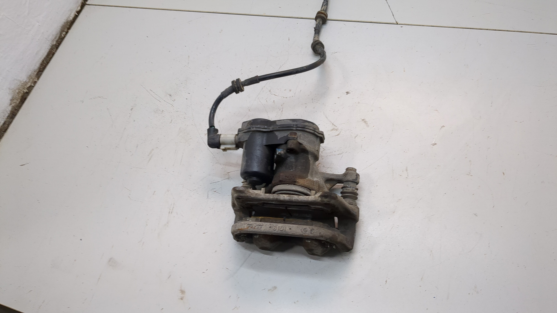 Суппорт задний левый