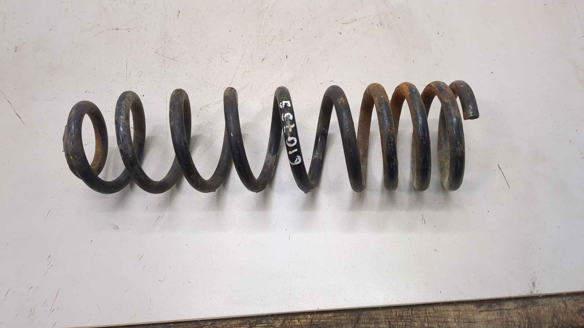 Пружина задняя