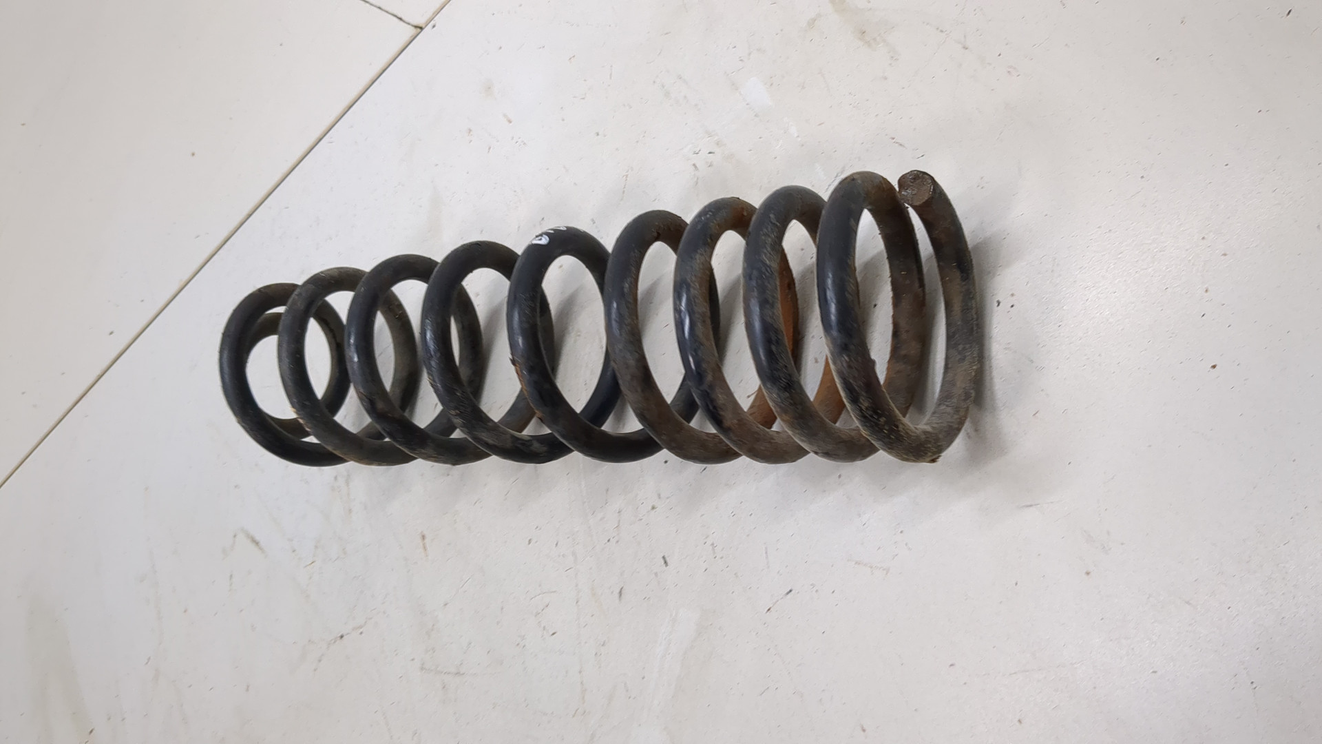 Пружина задняя