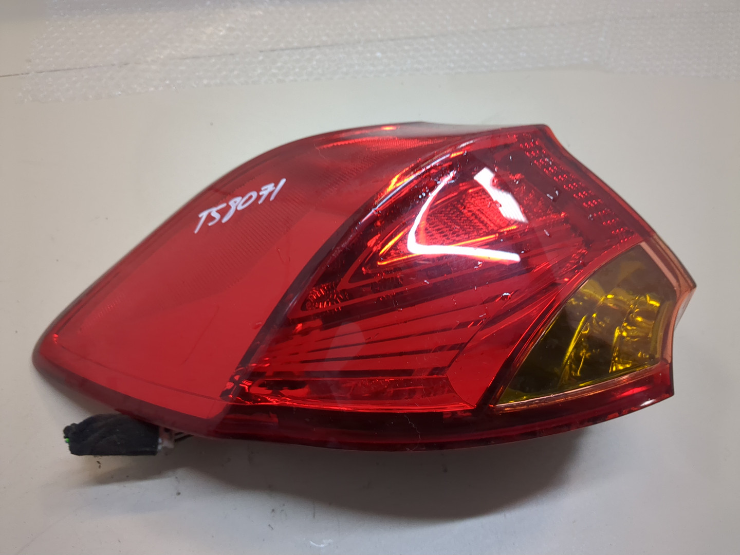 Фонарь задний левый