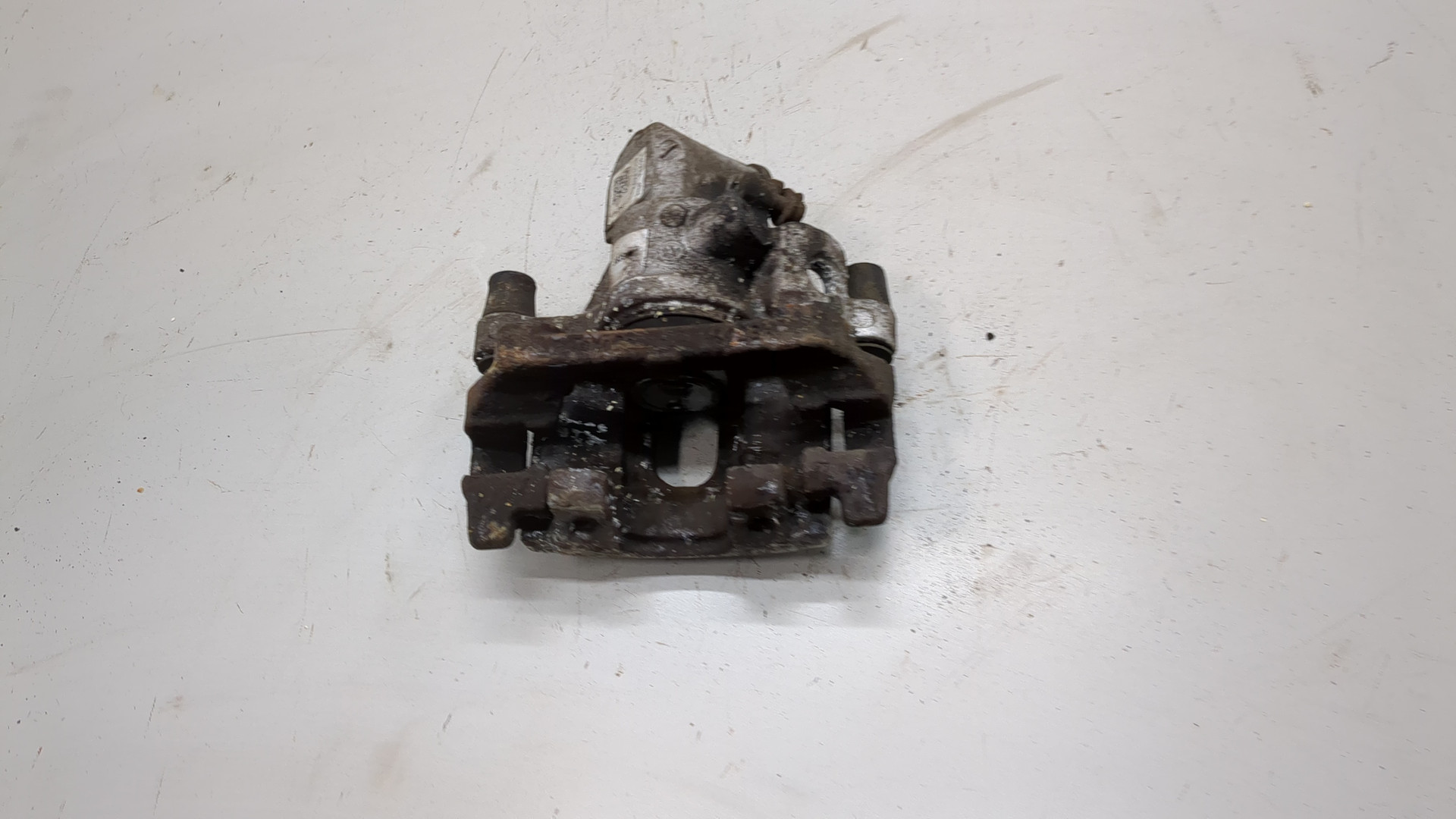 Суппорт задний левый