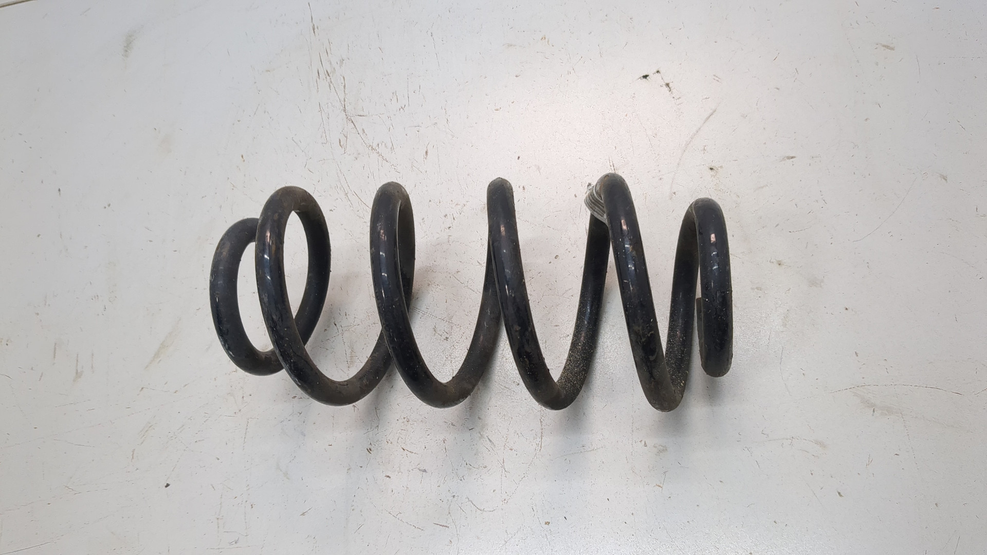 Пружина задняя