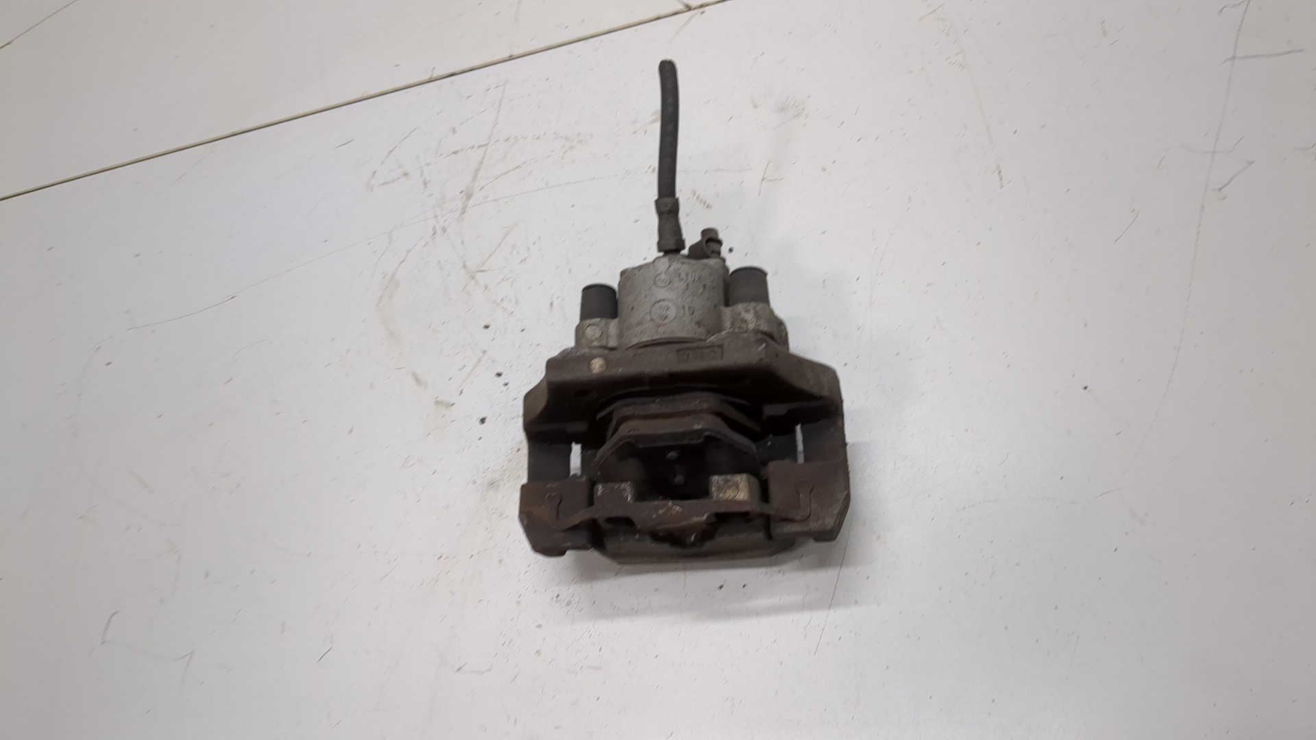 Суппорт задний левый