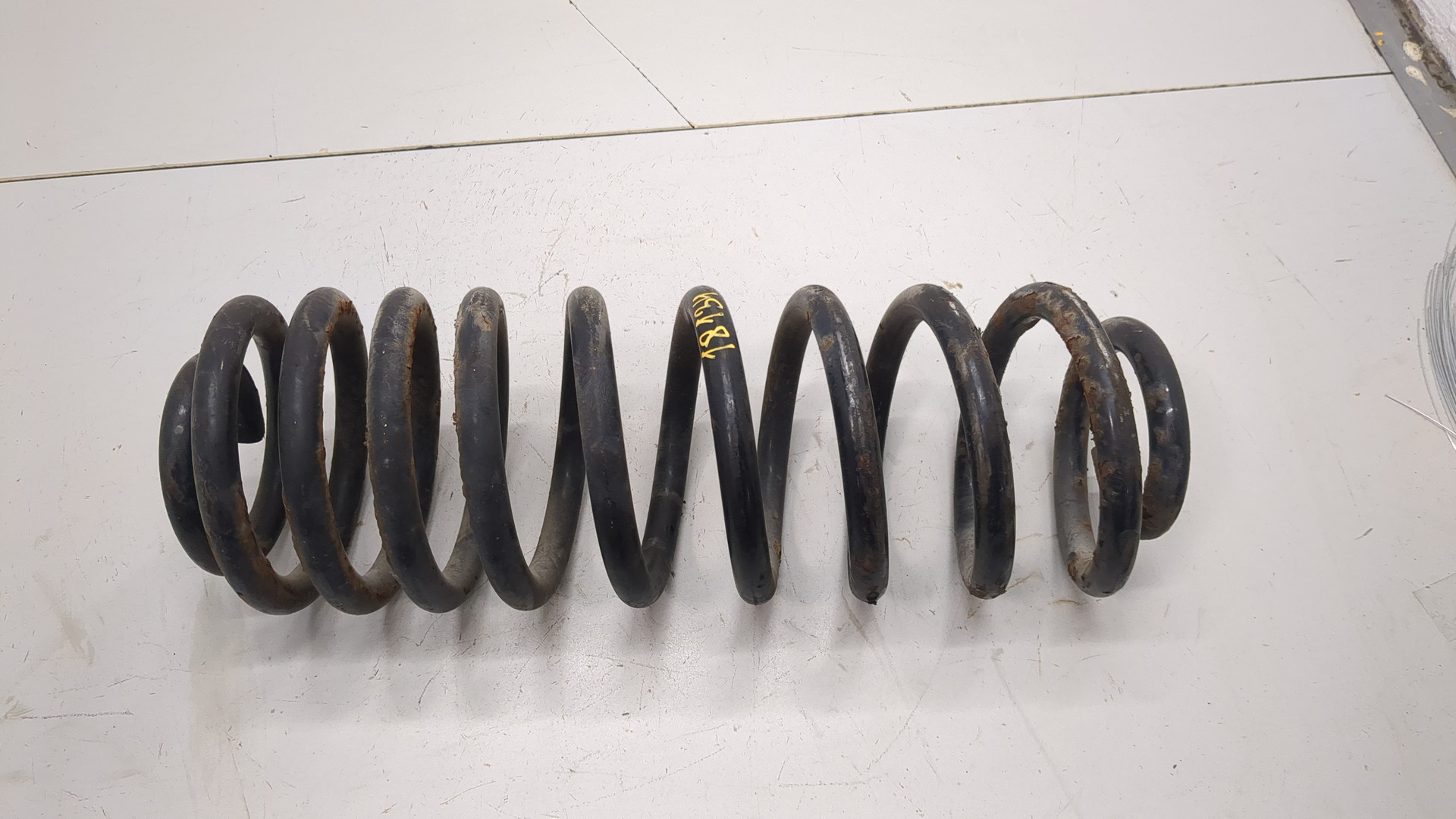 Пружина задняя