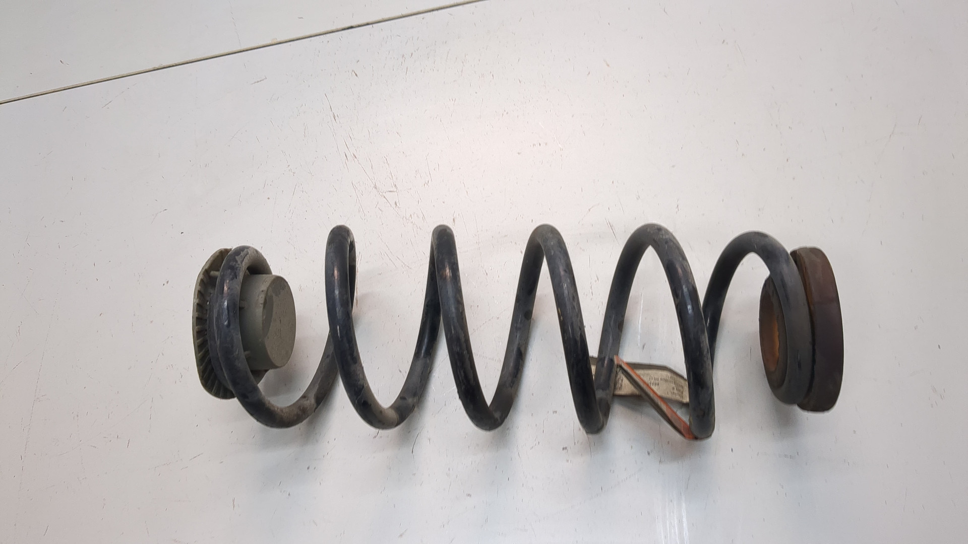 Пружина задняя