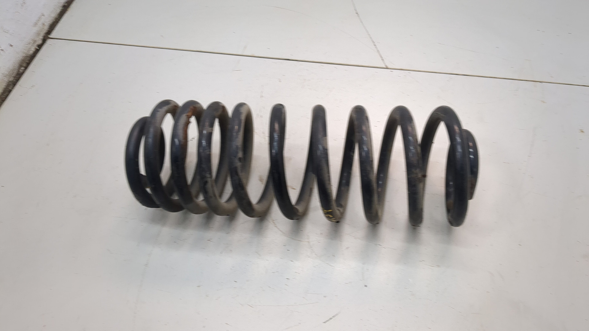 Пружина задняя