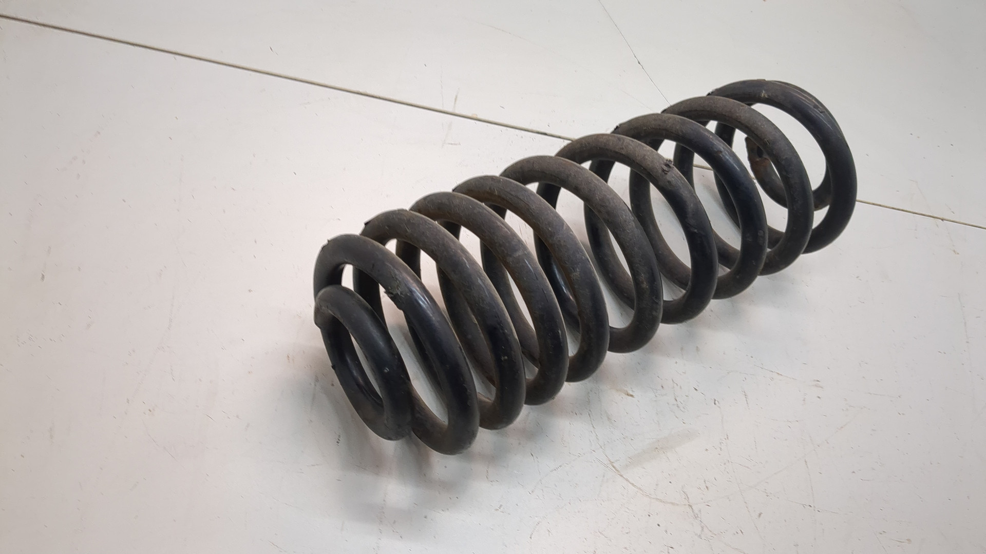 Пружина задняя