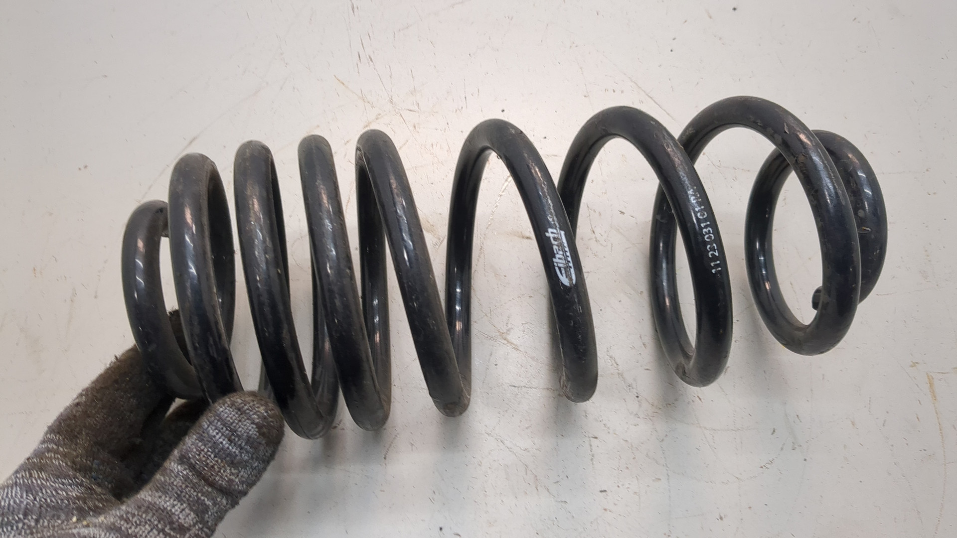 Пружина задняя