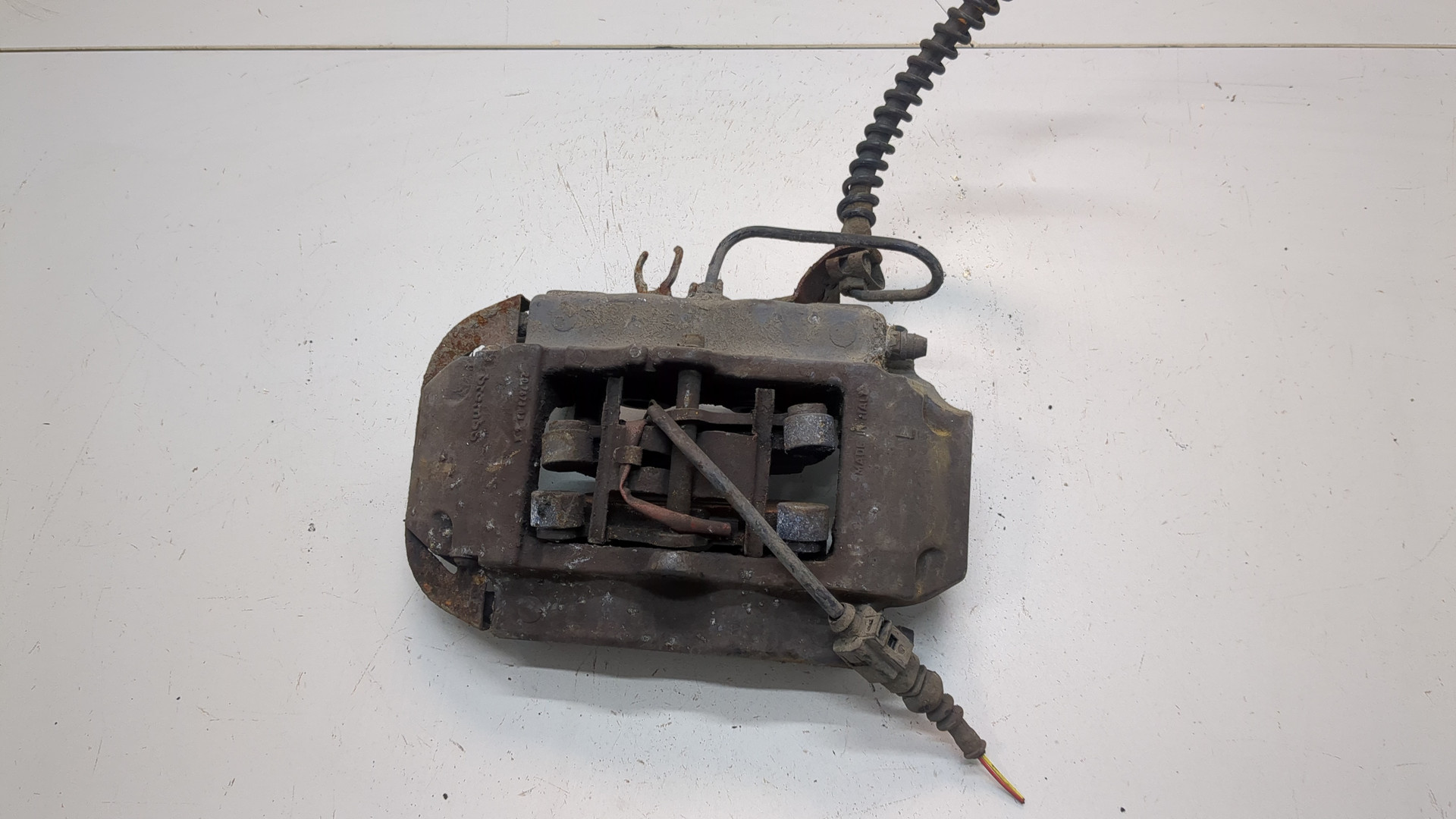 Суппорт задний левый