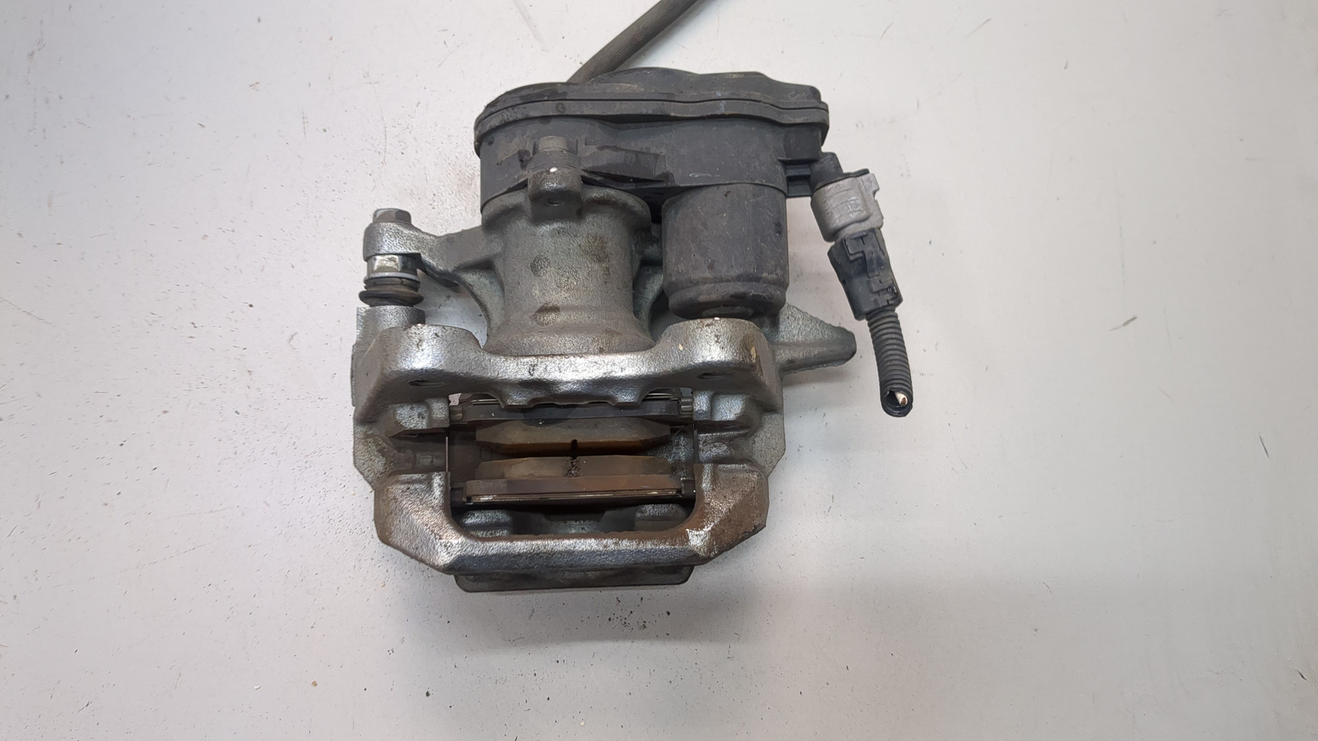 Суппорт задний левый