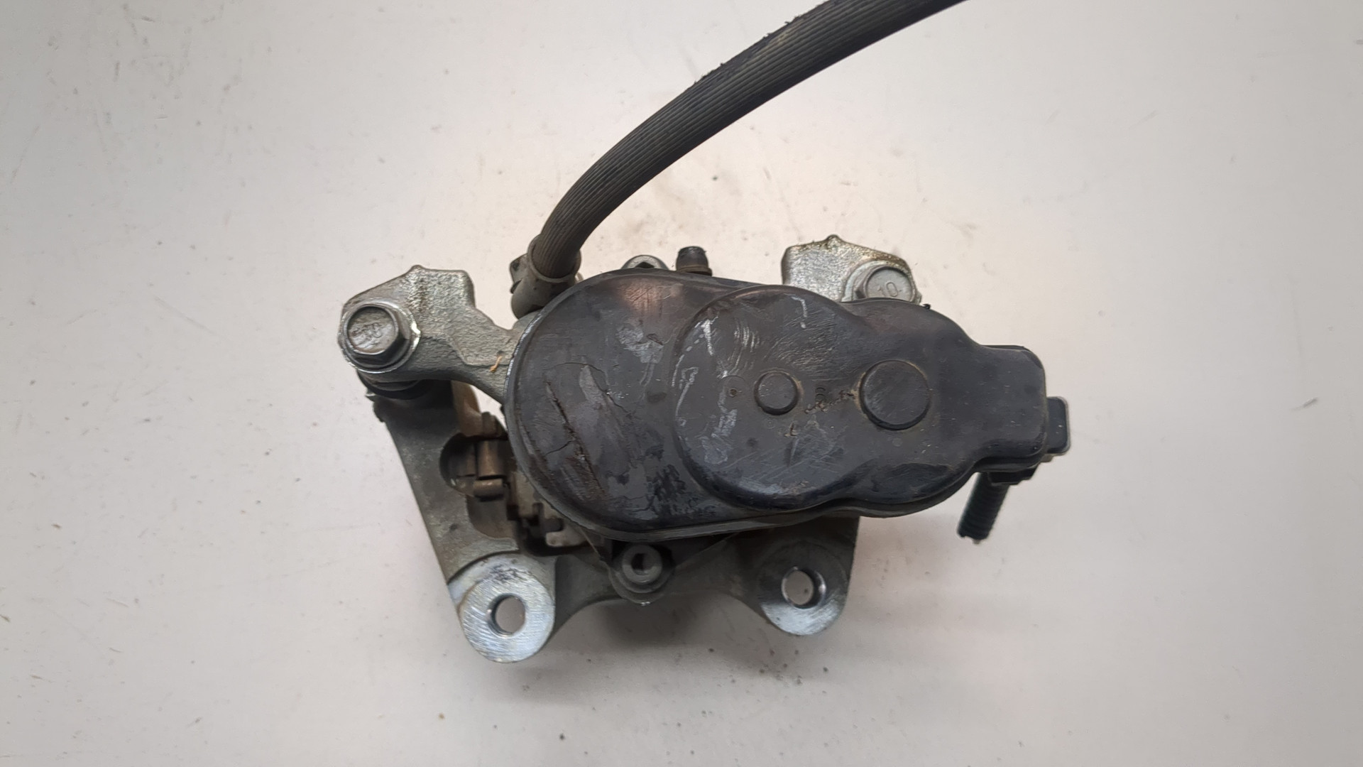 Суппорт задний левый