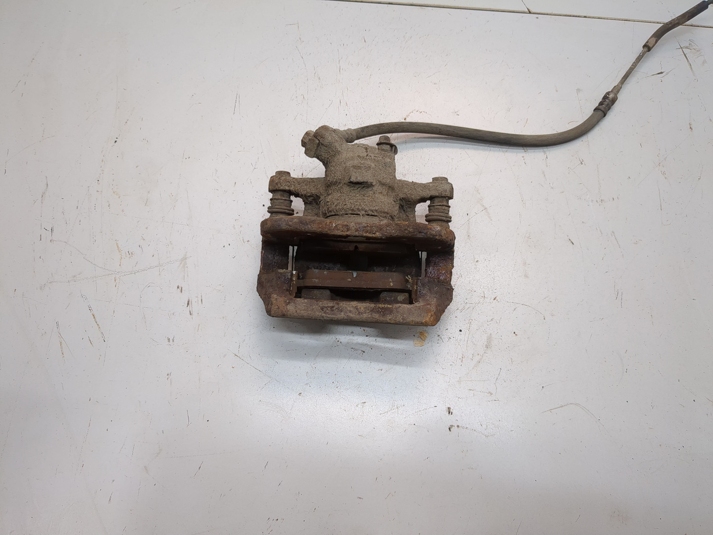 Суппорт задний левый