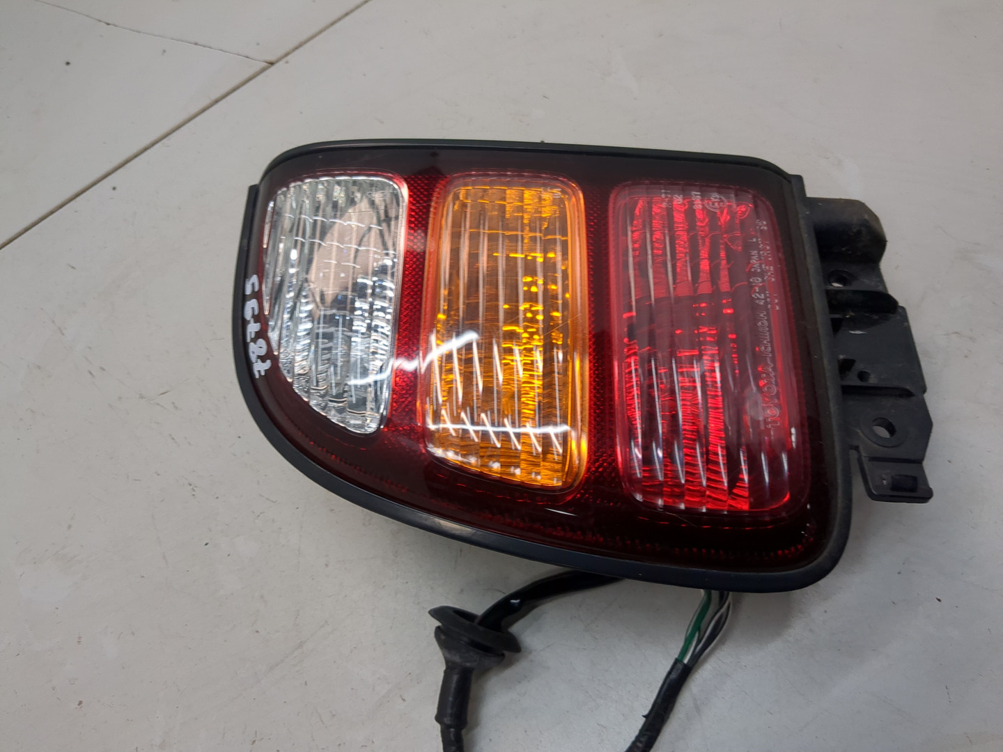 Фонарь задний левый