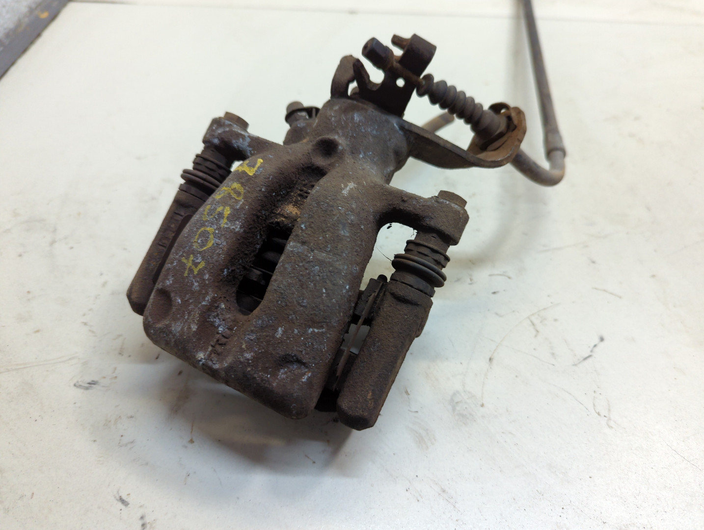 Суппорт задний левый