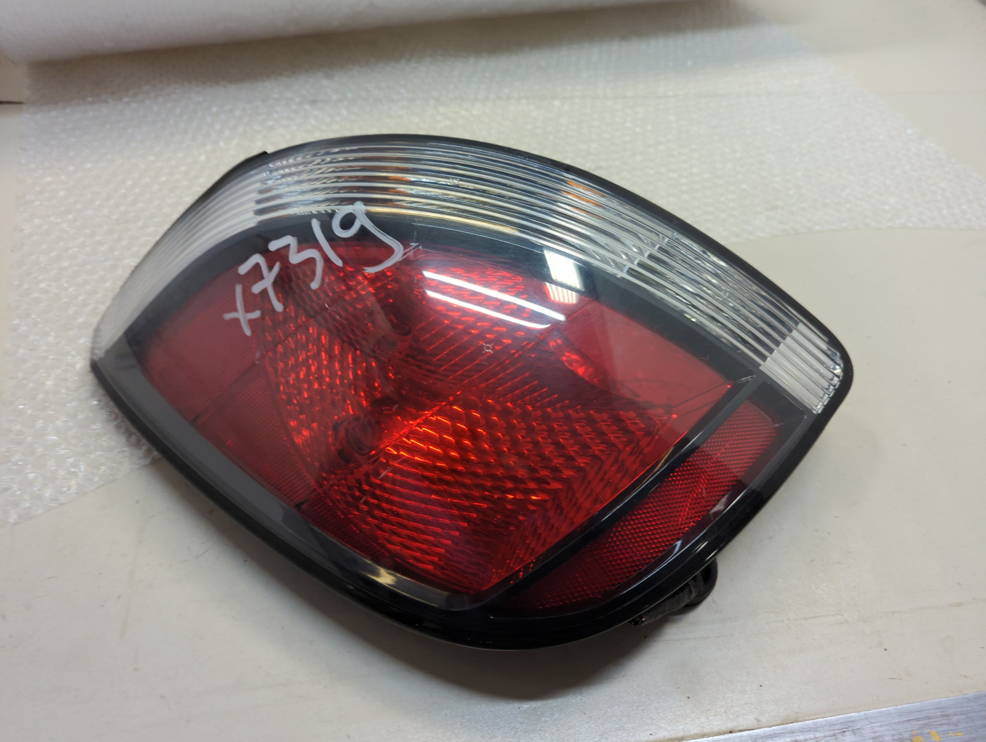 Фонарь задний левый