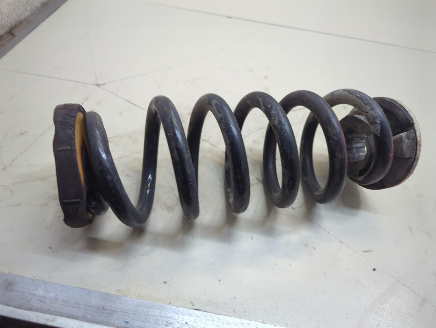 Пружина задняя