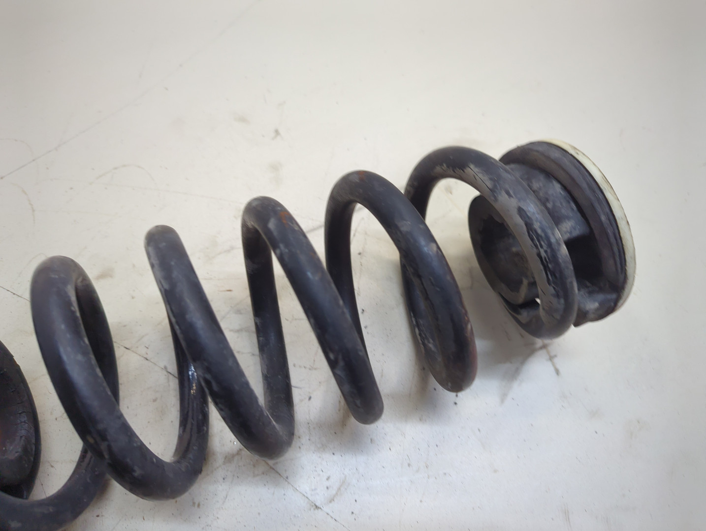 Пружина задняя