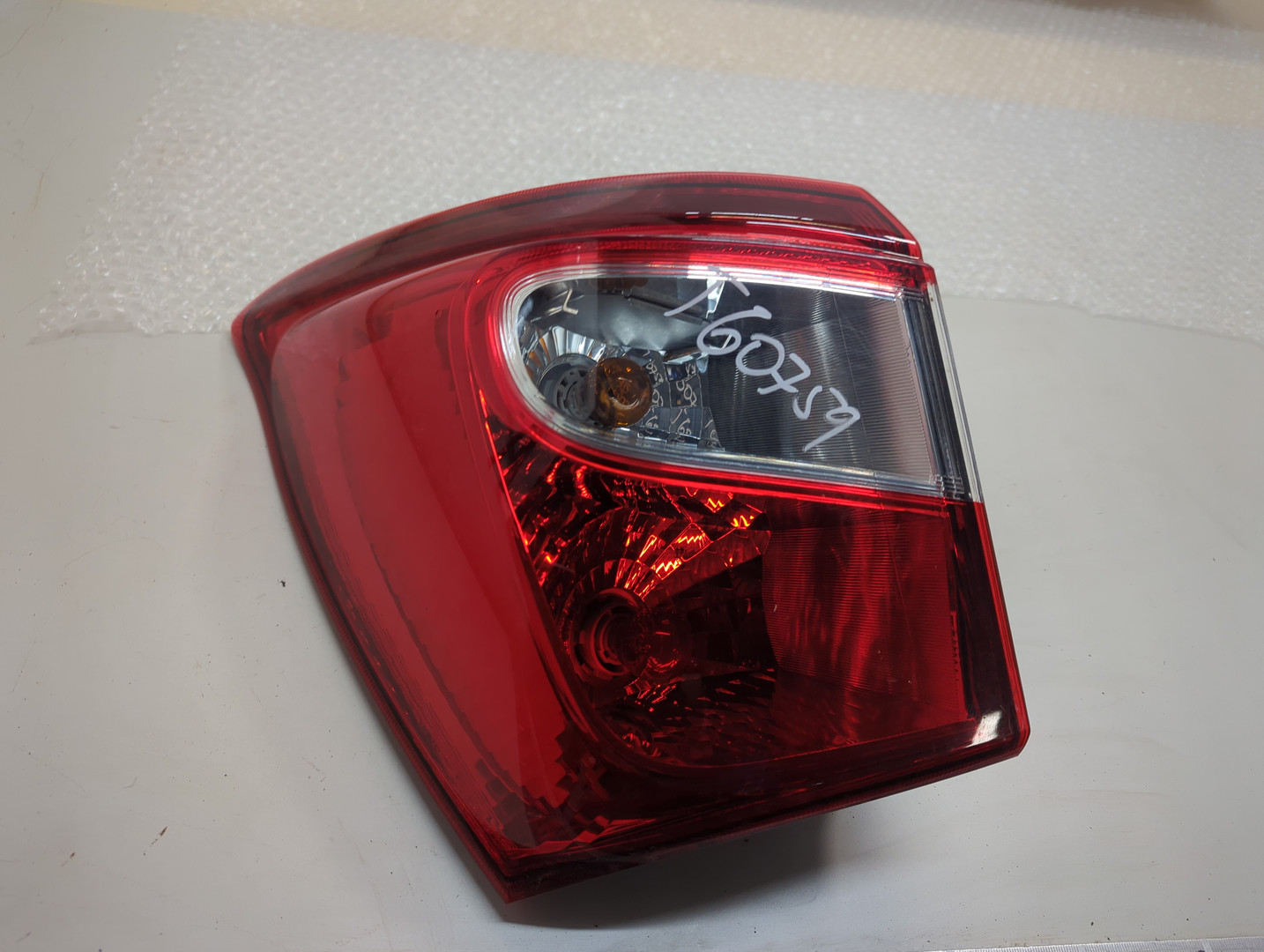 Фонарь задний левый