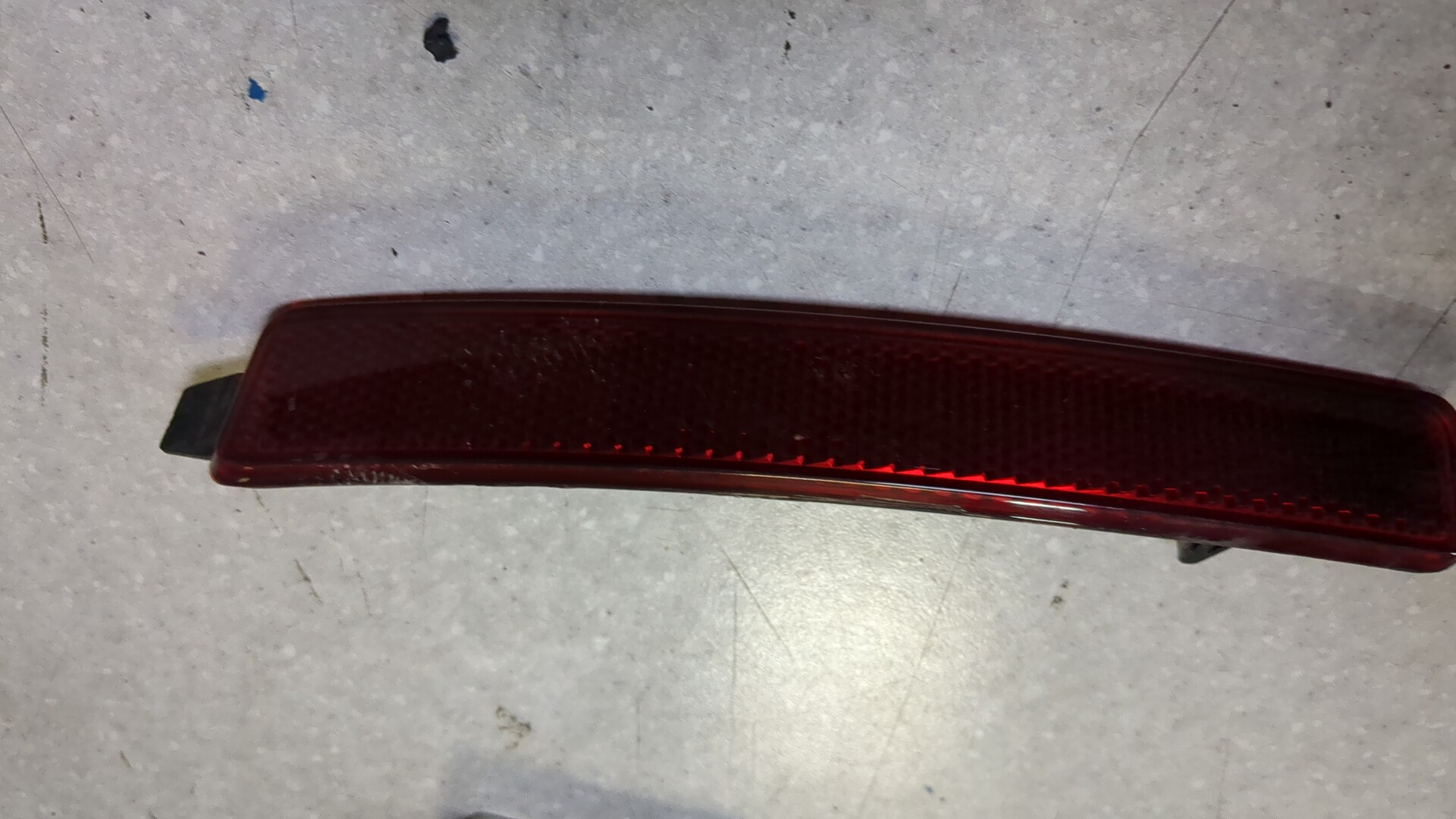 Отражатель в бампер задний левый