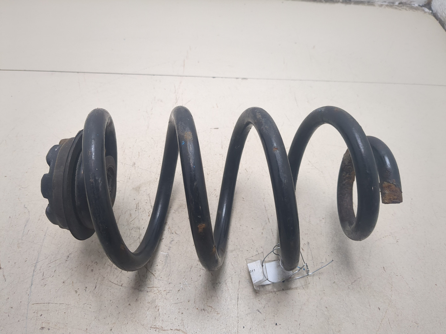 Пружина задняя